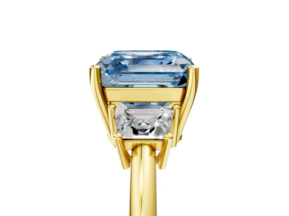 Fancy Blue Asscher Cut Diamond Three-Stone Ring with Trapezoid Side Stones and Prong Setting Yellow gold