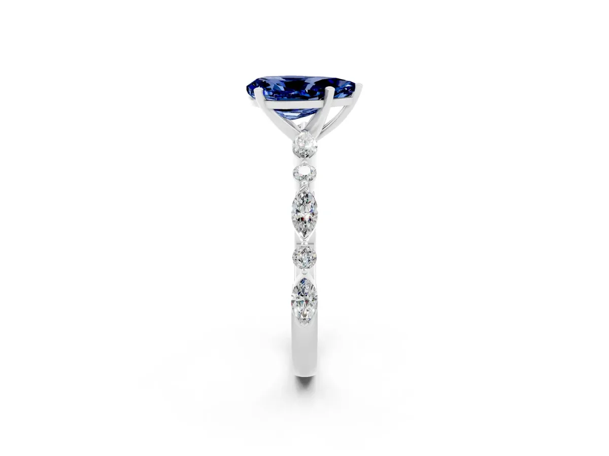 Pear Cut Blue Sapphire Ring with Marquise and Round Side Stones and Four-Prong Setting Silver