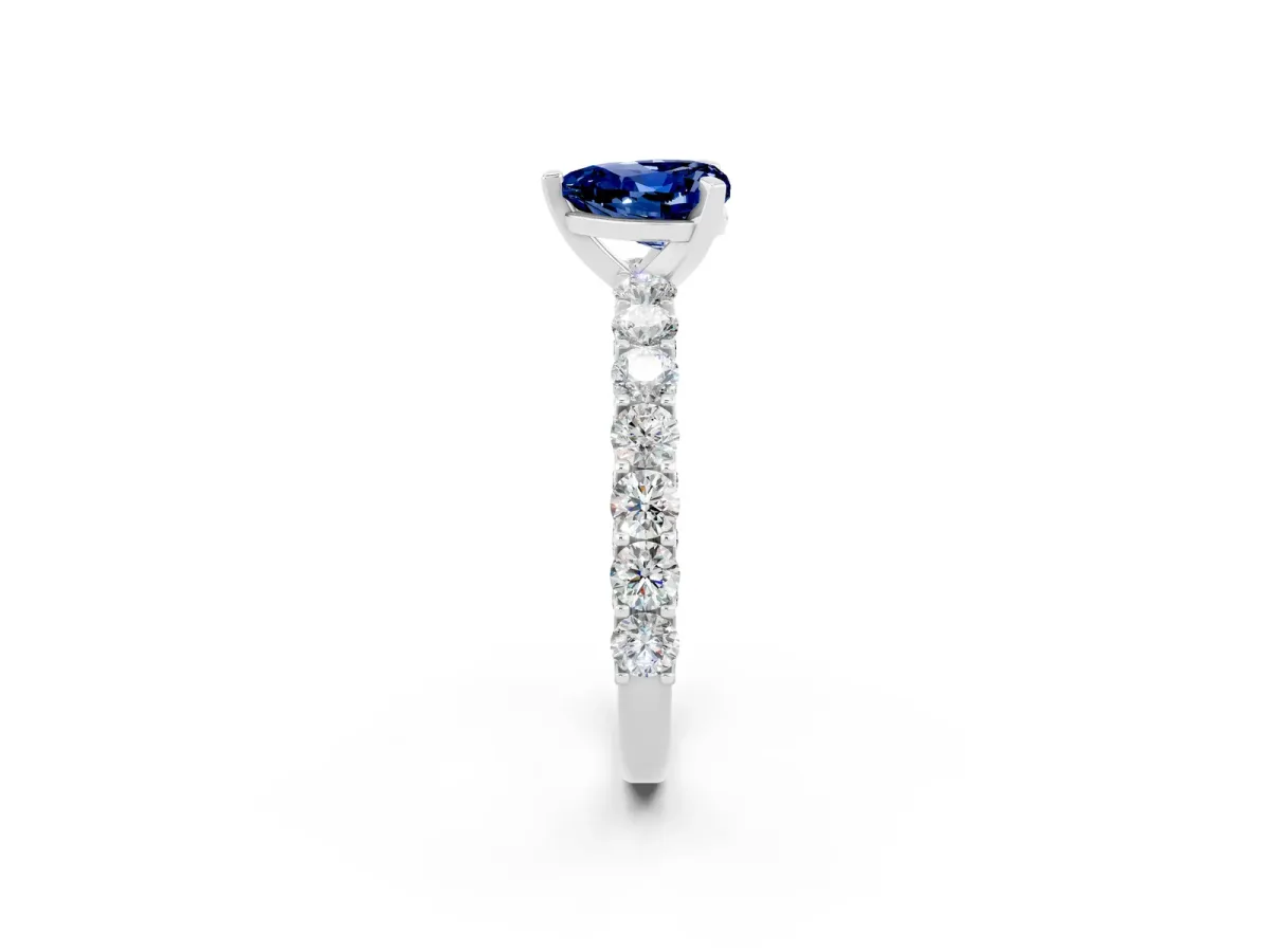 Heart Cut Blue Sapphire Solitaire Ring with Shared Prong Pavé Band and Four-Prong Setting Silver