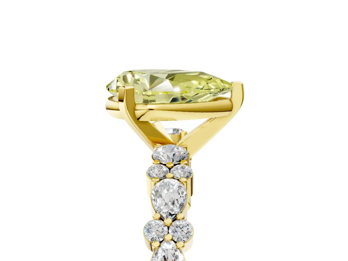 Fancy Yellow Pear Cut Diamond Side Stone Solitaire Ring with Round and Four-Prong Setting Yellow gold