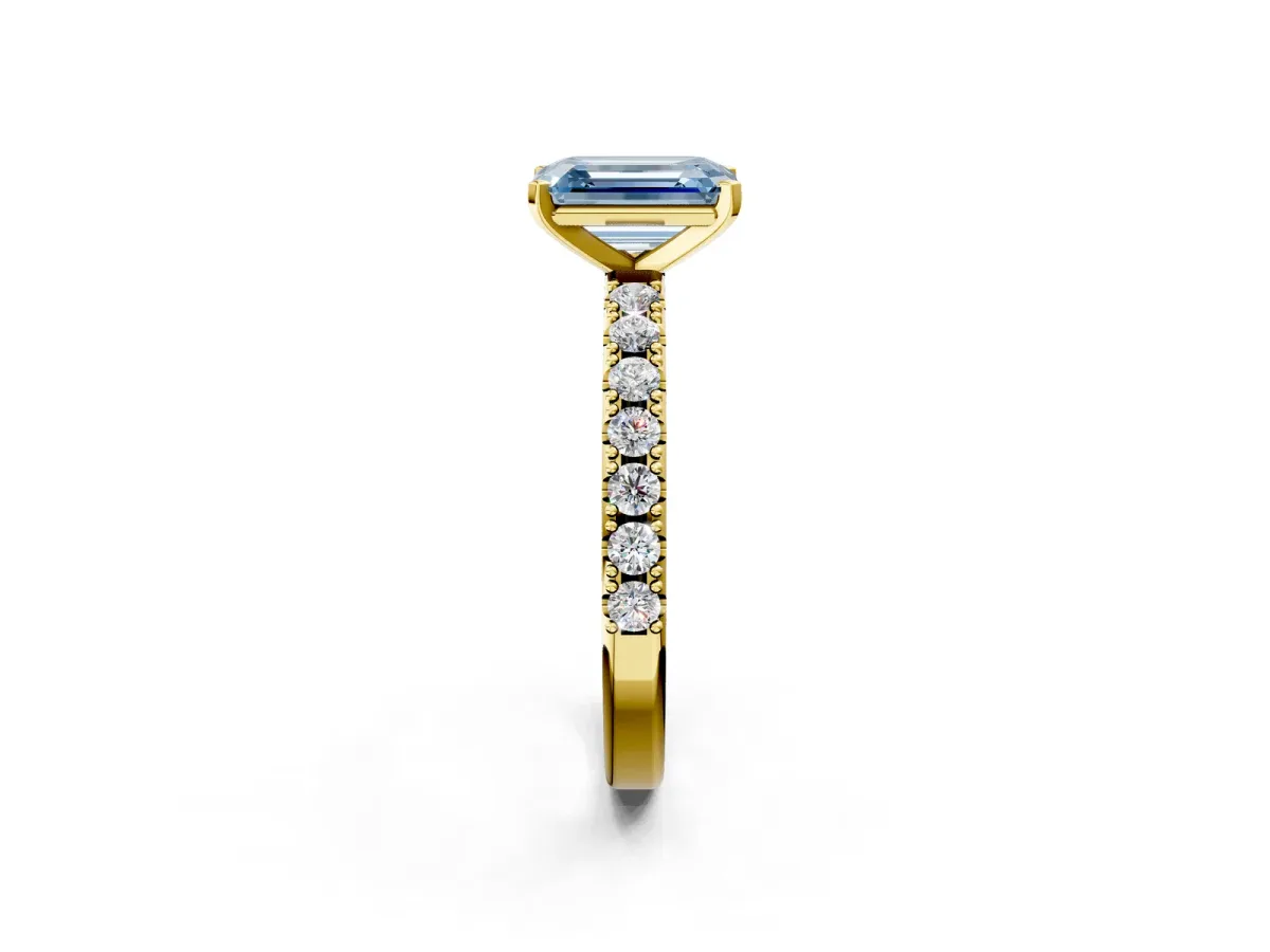 Fancy Blue Emerald Cut Diamond Solitaire Pavé Band with Four-Prong Setting Yellow gold