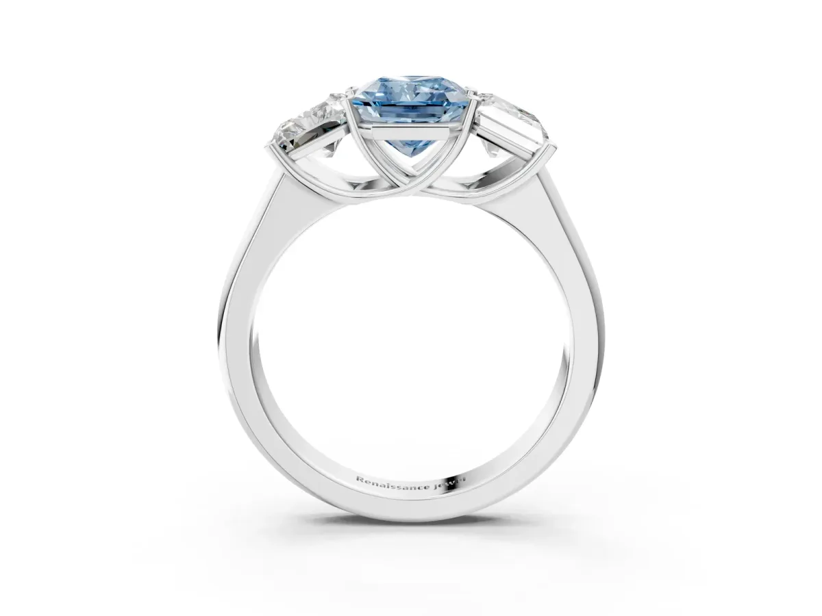 Fancy Blue Radiant Cut Three-Stone Diamond Ring with Prong Setting on a Classic Band Platinum