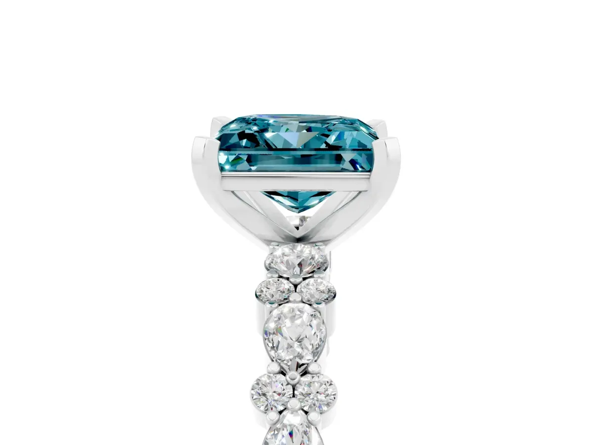 Princess Cut Blue Topaz Side Stone Solitaire Ring with Round and Four-Prong Setting Silver