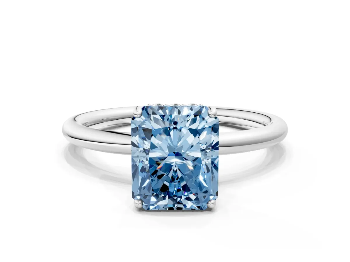 Fancy Blue Radiant Cut Solitaire Diamond Ring with a Classic Band and Four-Prong Setting Platinum