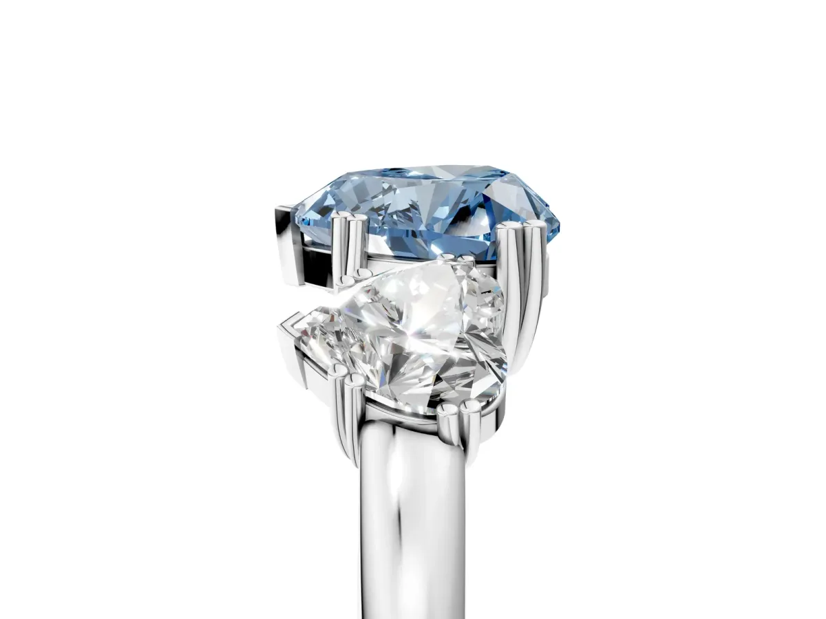 Fancy Blue Three-Stone Heart Cut Cut Diamond Ring with Channel Set Band and Four-Prong Setting Silver