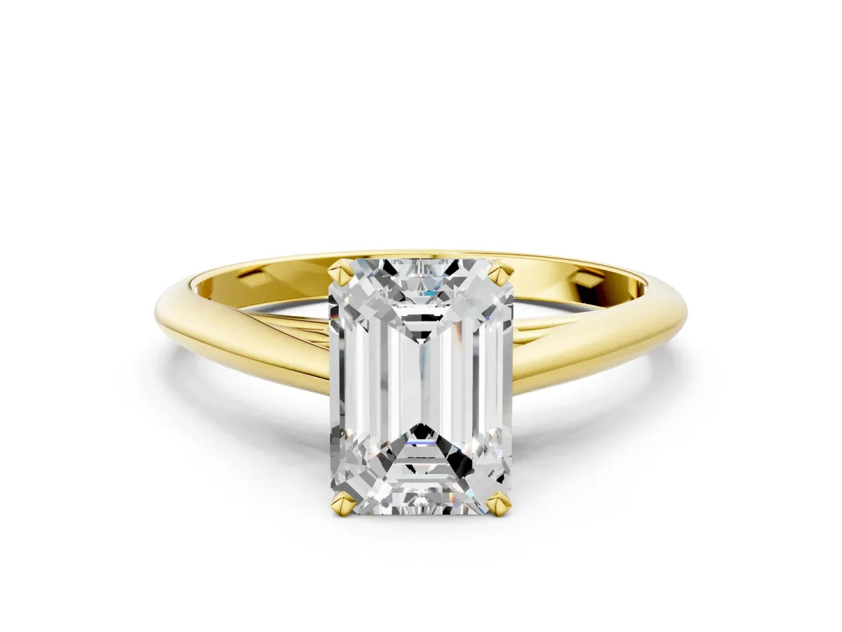 Emerald Cut Diamond Solitaire Engagement Ring with Cathedral Setting and Four-Prong Mount Yellow gold
