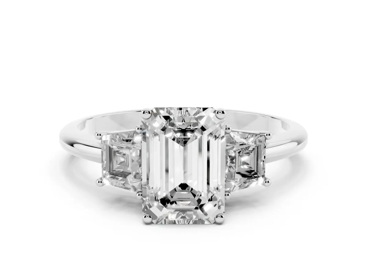 Emerald Cut Diamond Three-Stone Ring with Trapezoid Side Stones and Prong Setting White gold