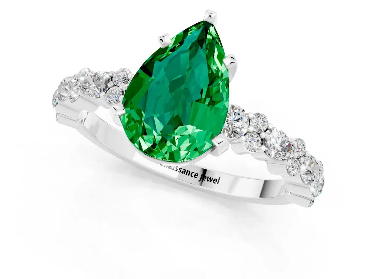 Pear Cut Emerald Side Stone Solitaire Ring with Round and Four-Prong Setting Silver