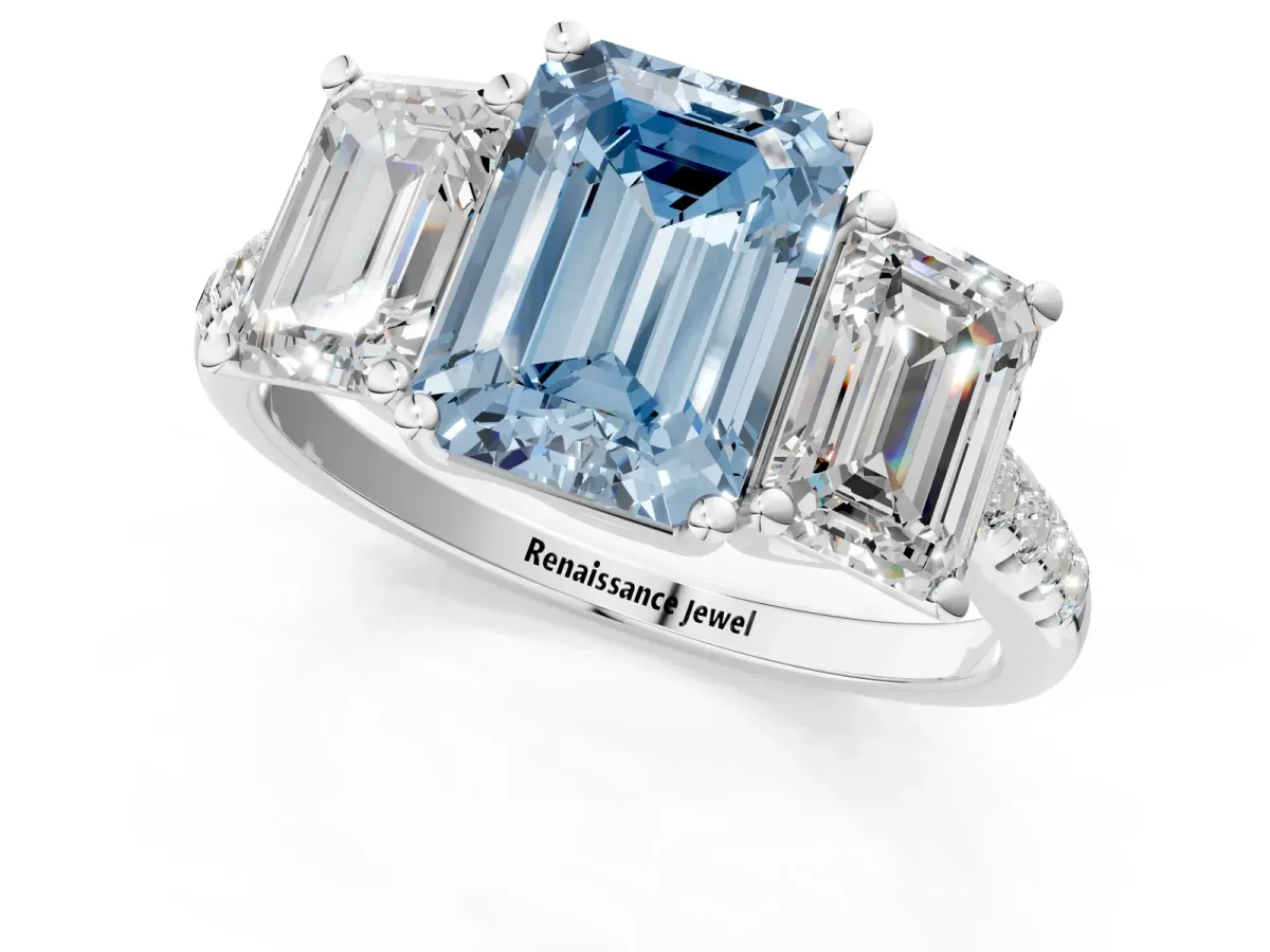 Fancy Blue Three-Stone Emerald Cut Diamond Ring with Round Pavé Band and Prong Setting Platinum