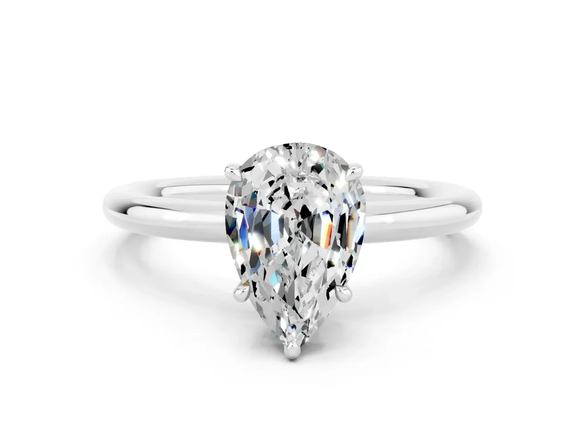 Pear Cut Moissanite Solitaire Ring with Thin Band and Four-Prong Setting Silver
