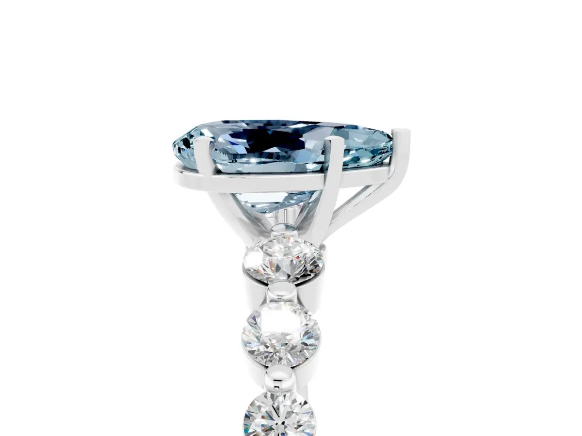 Pear Cut Solitaire Aquamarine Ring with Pave Band and Four-Prong Setting Silver