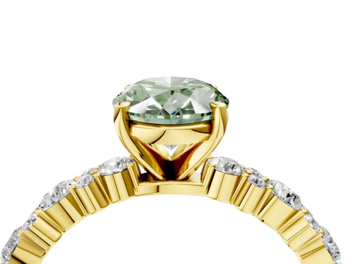Fancy Green Oval Cut Diamond Side Stone Solitaire Ring with Round and Four-Prong Setting Yellow gold