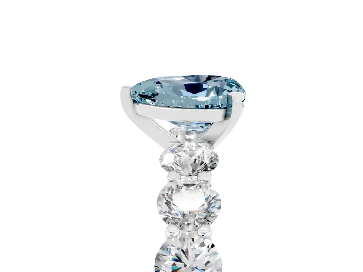 Heart Cut Aquamarine Prong Setting with Side Stones on a Pave Band Silver