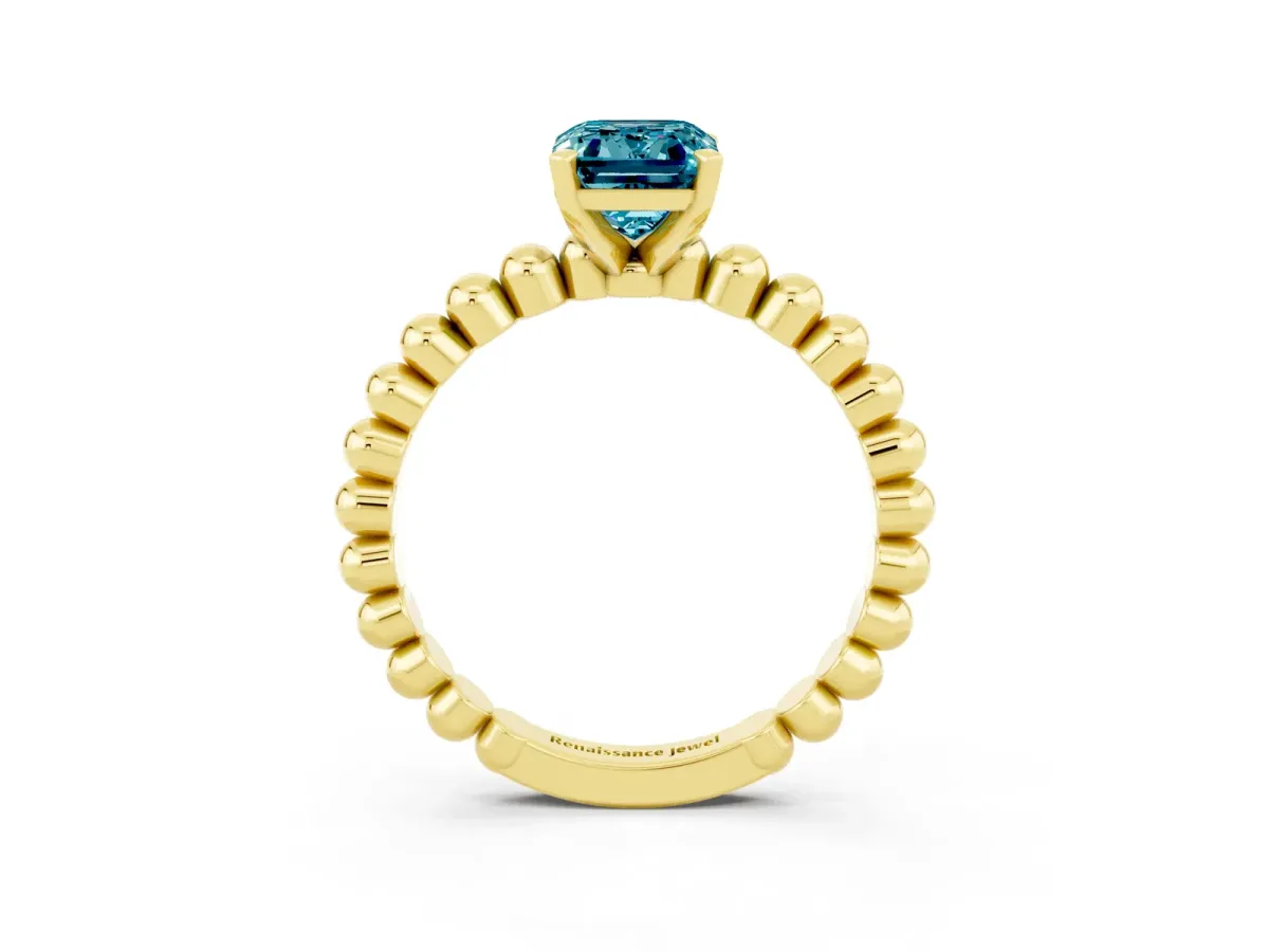 Emerald Cut Blue Topaz Solitaire Ring with Beaded Band and Prong Setting Yellow gold