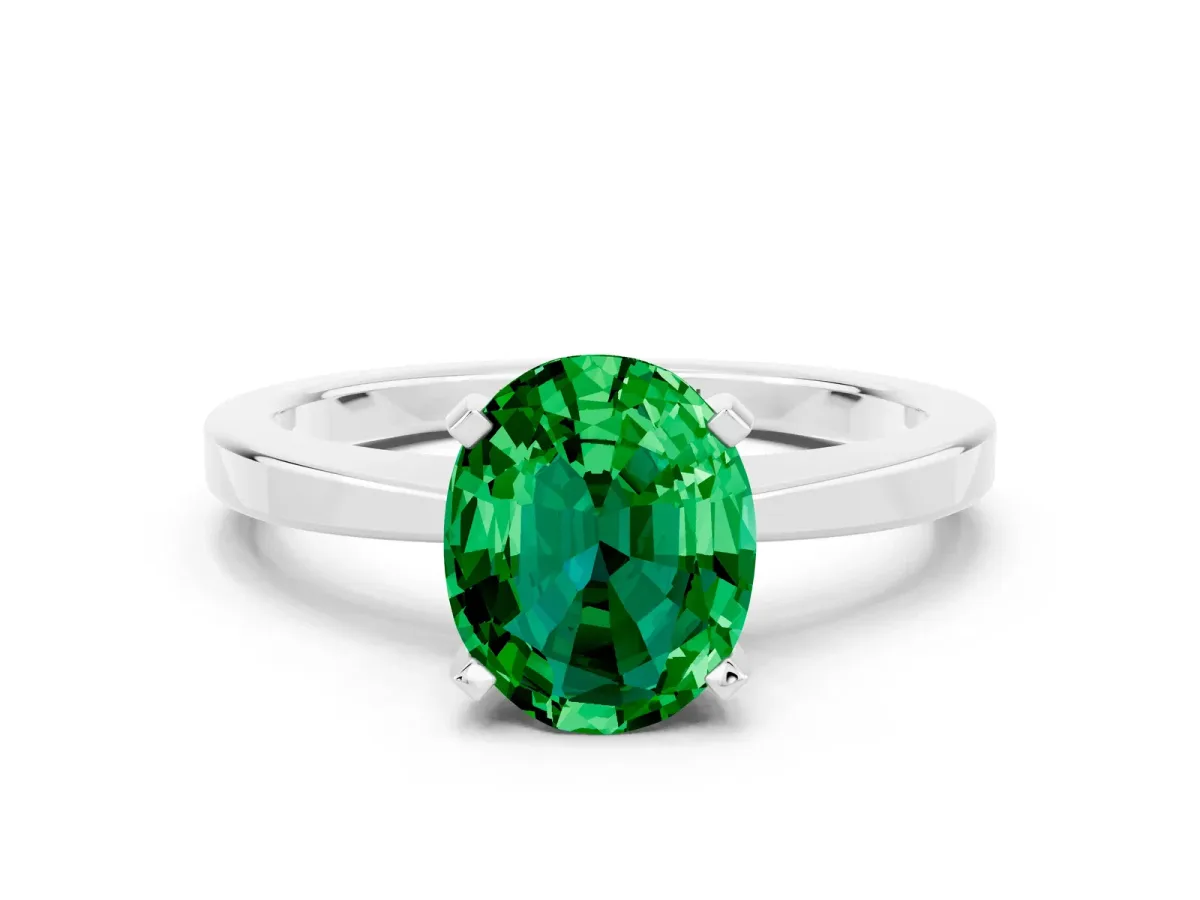 Oval Cut Emerald Solitaire Engagement Ring with Classic Band and Four-Prong Setting Silver