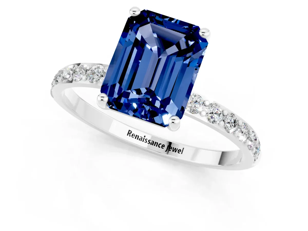 Emerald Cut Blue Sapphire Solitaire Ring with Round Pavé Band and Prong Setting Silver