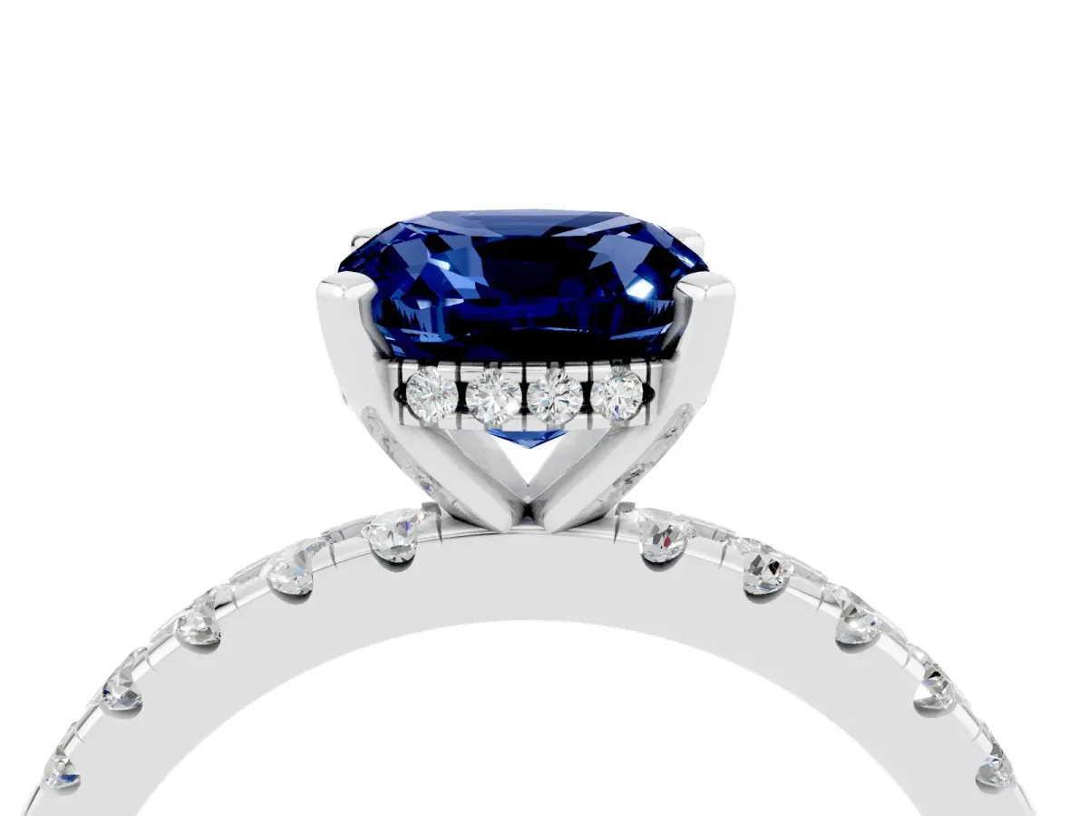 Cushion Cut Blue Sapphire Solitaire Ring with Round Pavé Band and Four-Prong Setting Silver