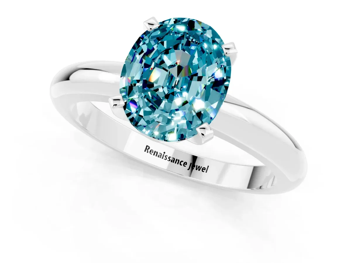 Oval Cut Blue Topaz Solitaire Engagement Ring with Round Band and Four-Prong Setting Silver