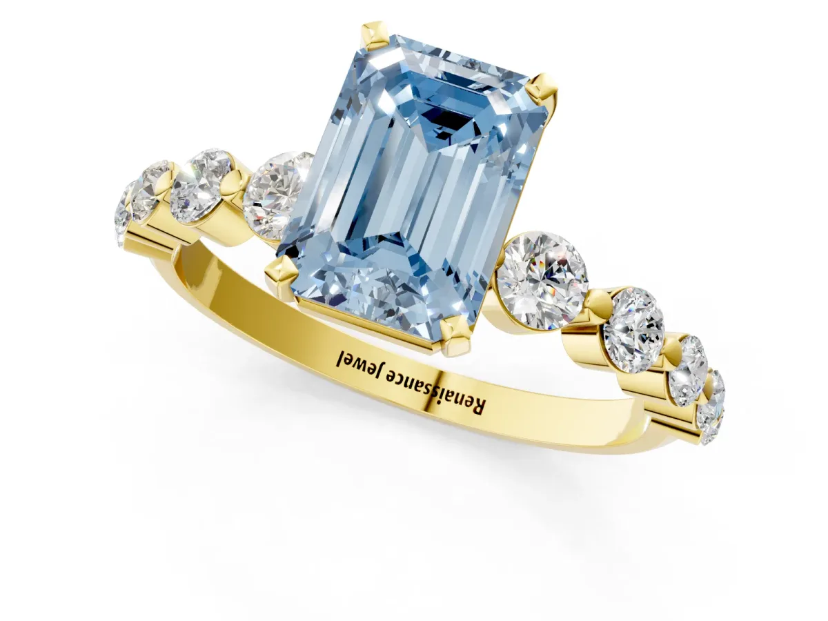 Fancy Blue Emerald Cut Solitaire Diamond Ring with Pave Band and Four-Prong Setting Yellow gold
