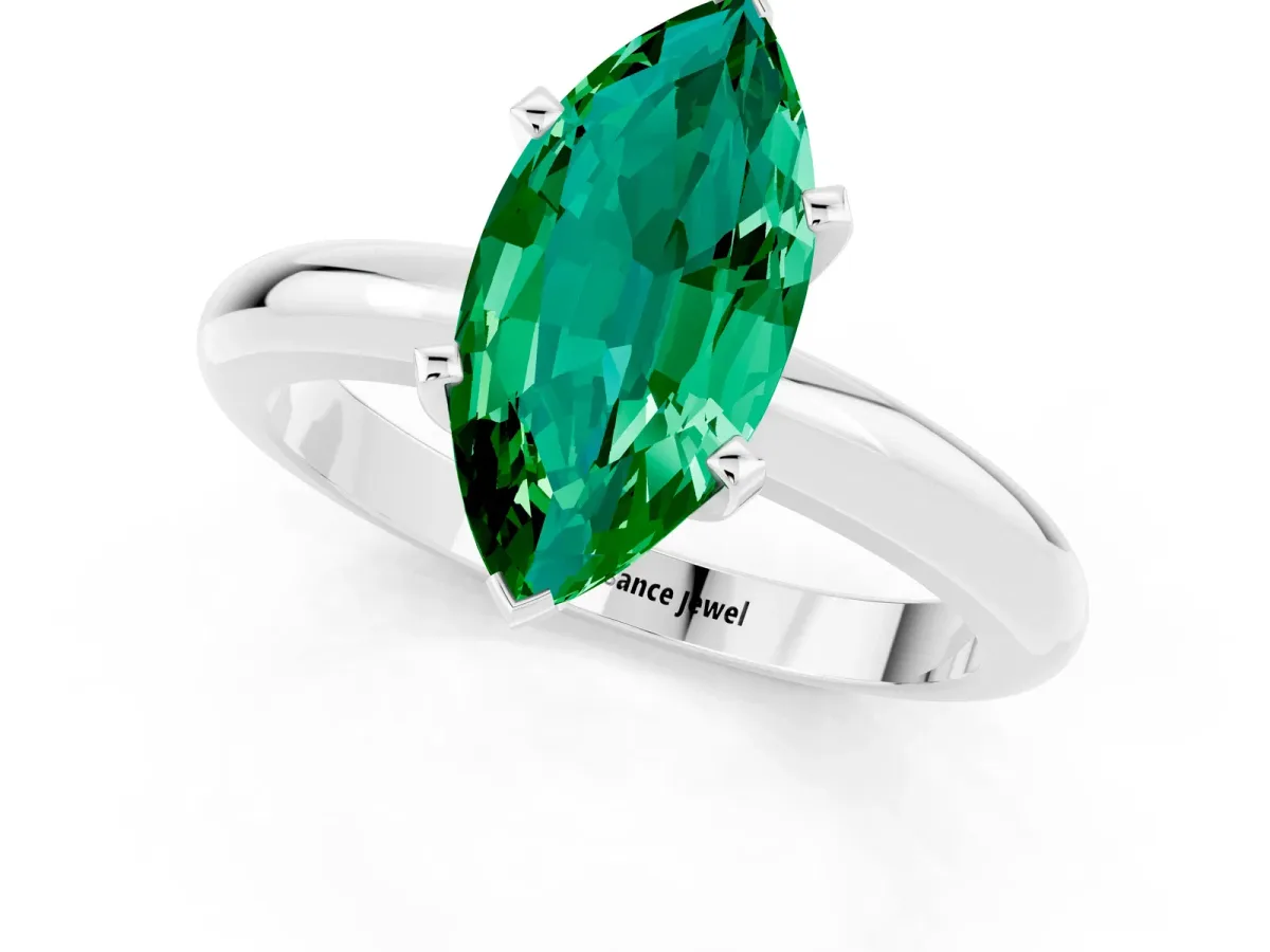 Marquise Cut Emerald Solitaire Engagement Ring with Round Band and Four-Prong Setting Silver