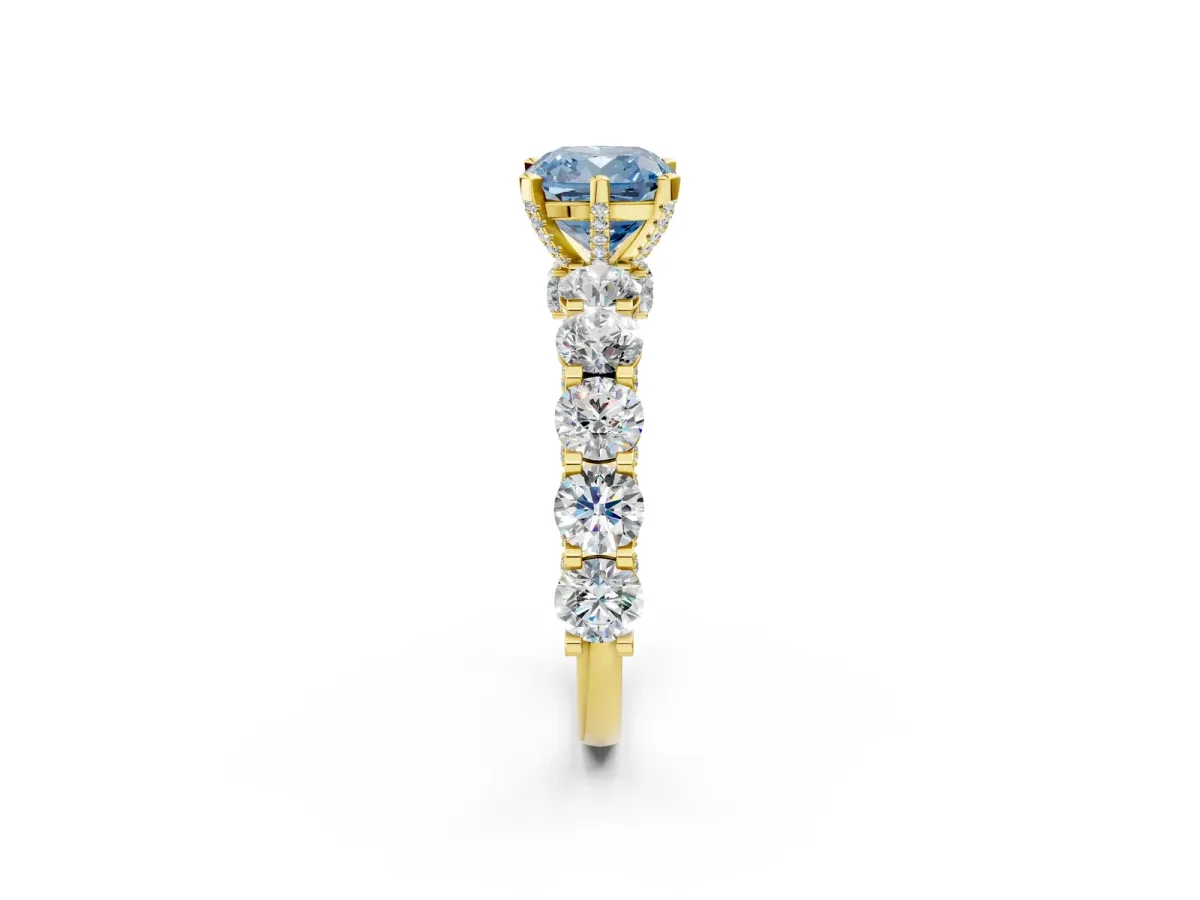 Fancy Blue Cushion Cut Diamond Side Stone Engagement Ring with Four-Prong Setting Yellow gold