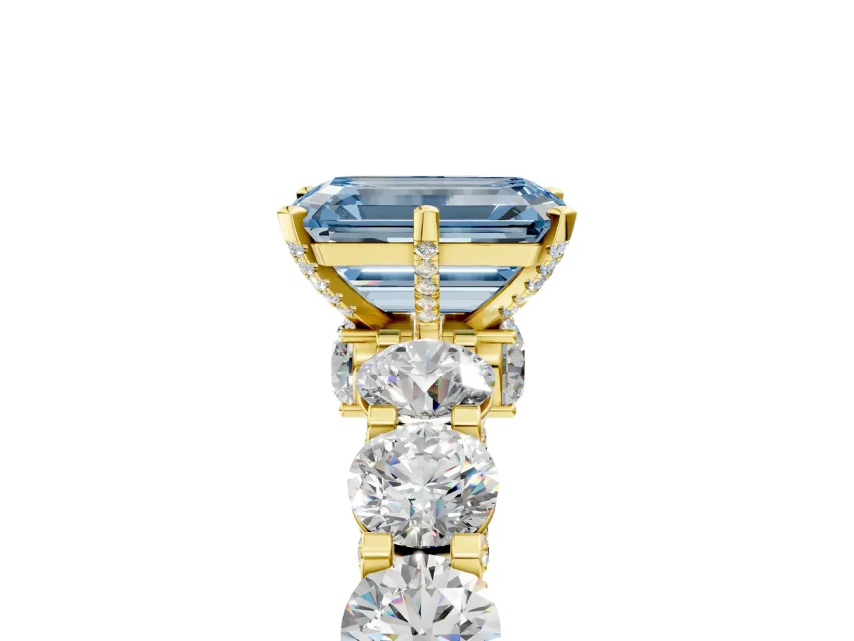 Fancy Blue Emerald Cut Diamond Side Stone Engagement Ring with Four-Prong Setting Yellow gold