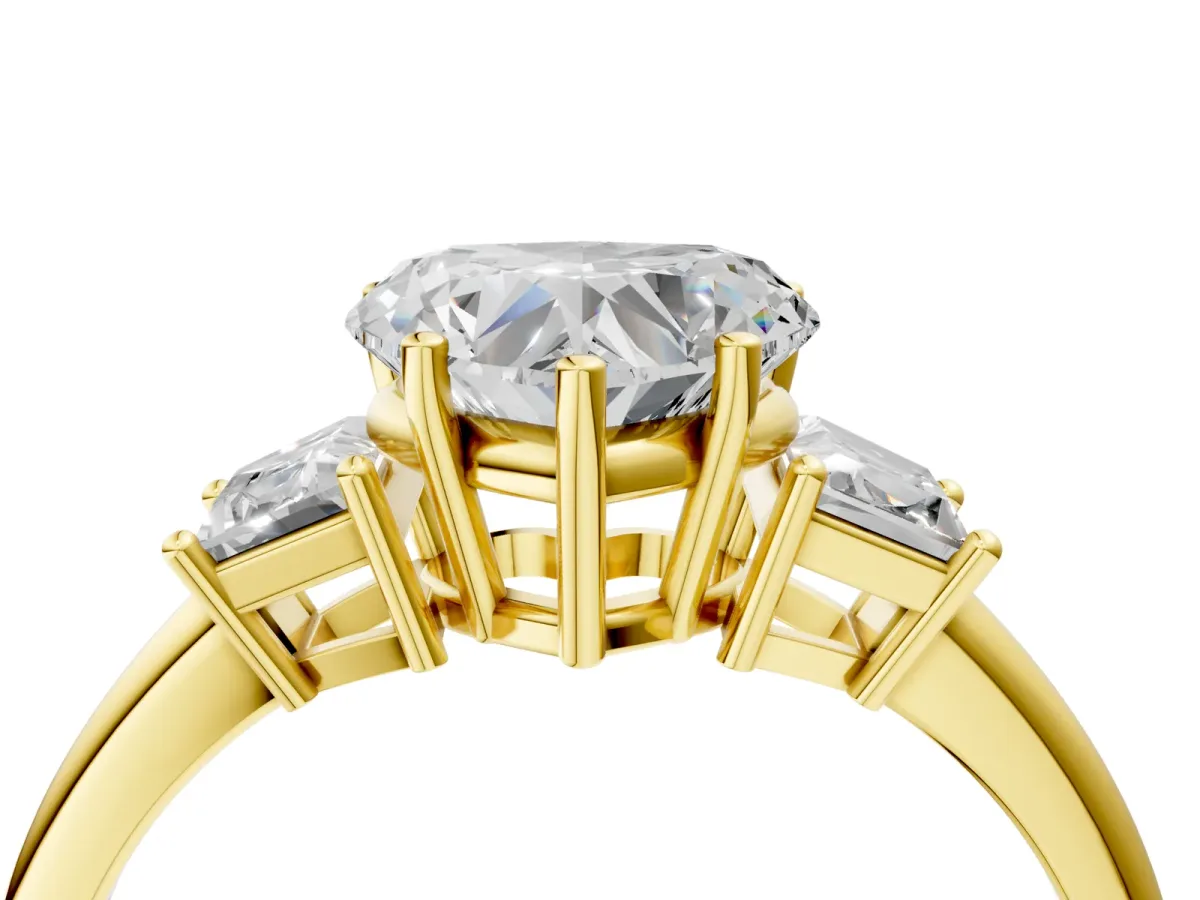 Heart Cut Diamond Three-Stone Ring with Trapezoid Side Stones and Prong Setting Yellow gold