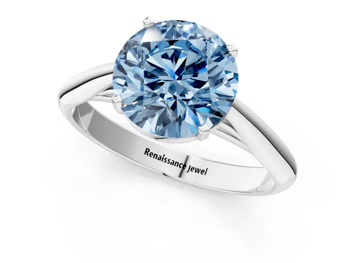 Fancy Blue Round Cut Diamond Solitaire Engagement Ring with Cathedral Setting and Four-Prong Mount White gold