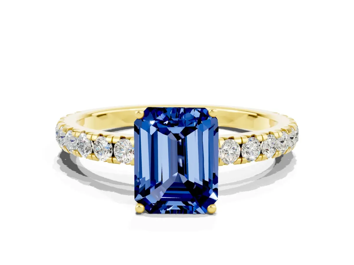Emerald Cut Blue Sapphire Pavé Solitaire Engagement Ring with Four-Prong Setting Yellow gold