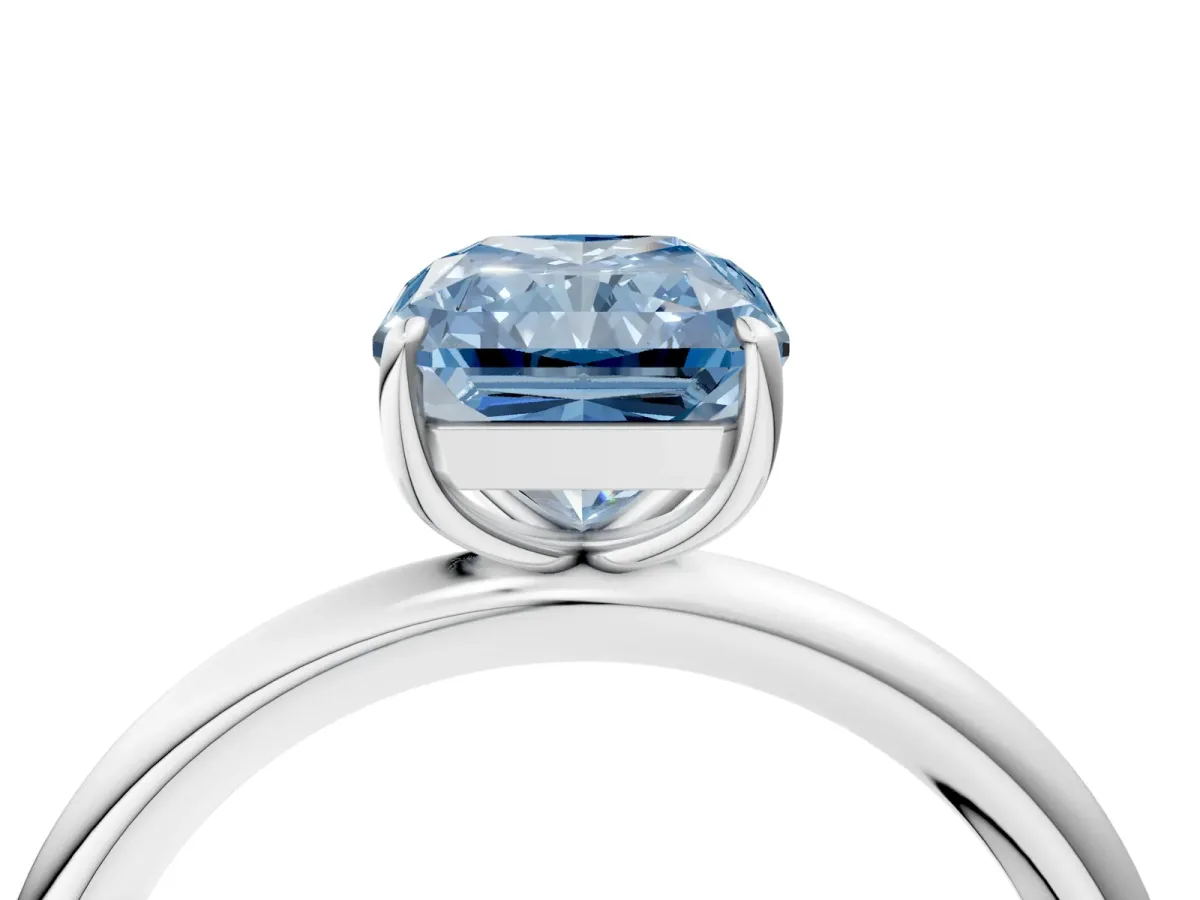 Fancy Blue Radiant Cut Solitaire Diamond Ring with Four-Prong Setting on a Plain Band Platinum