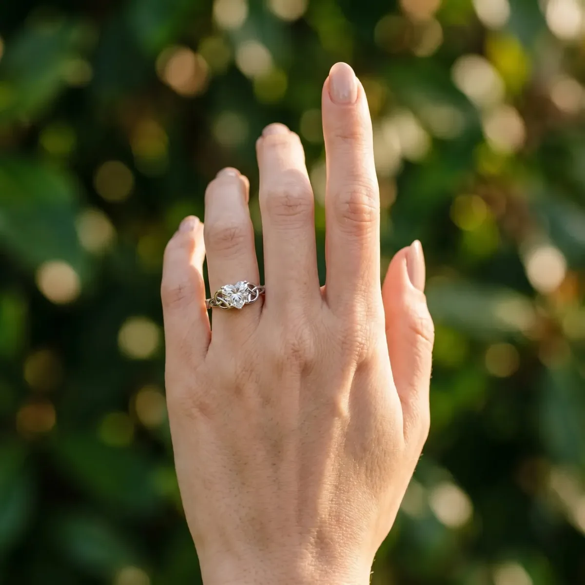 Heart Cut Diamond Solitaire Engagement Ring with Celtic Knot Band and Four-Prong Setting Silver