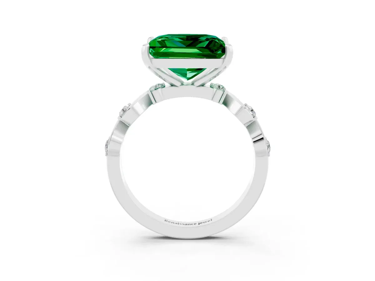 Princess Cut Emerald Solitaire Twisted Band with Round Accents and Prong Setting Silver