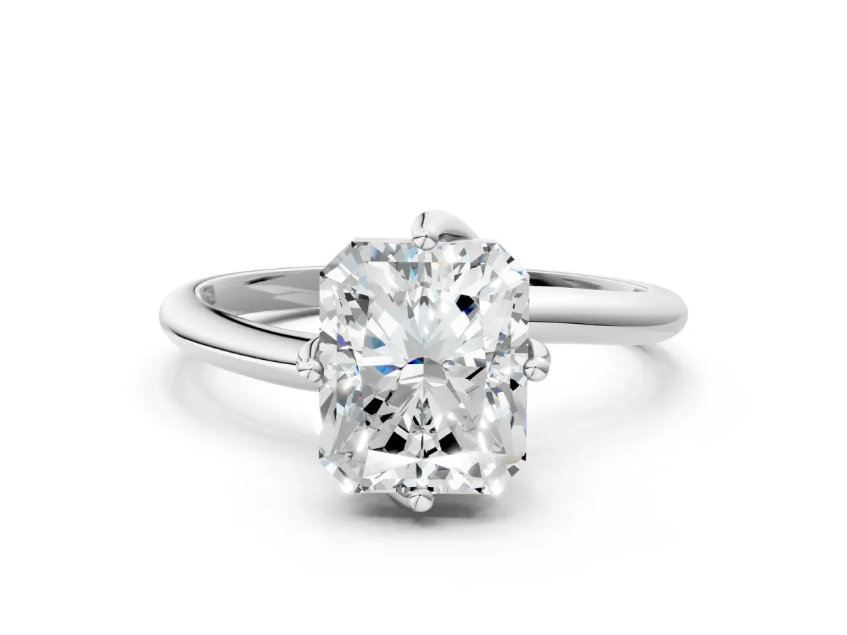 Radiant Cut Diamond Solitaire Engagement Ring with Four-Prong Setting and Classic Band Platinum