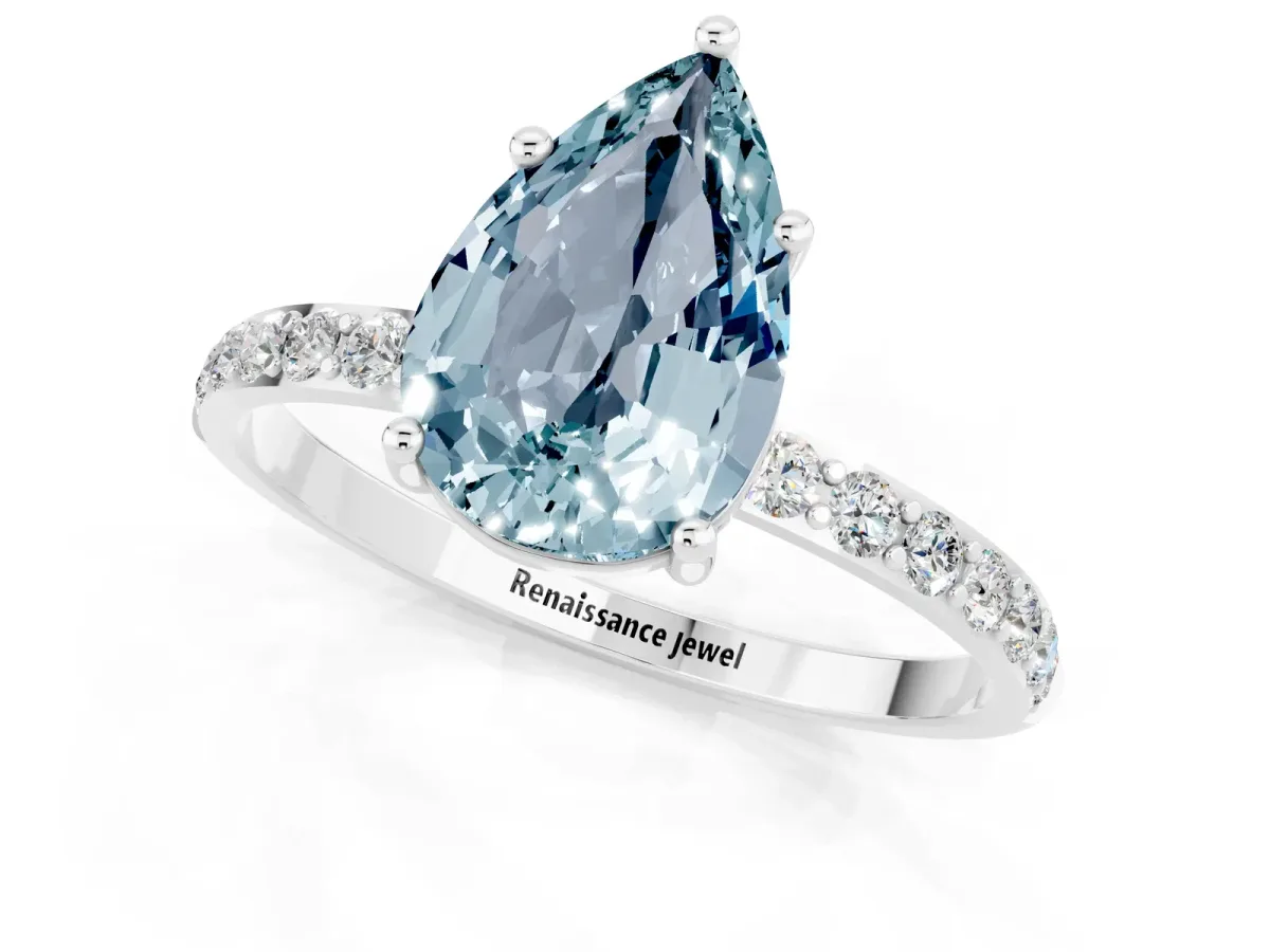 Pear Cut Aquamarine Solitaire Ring with Round Pavé Band and Prong Setting Silver