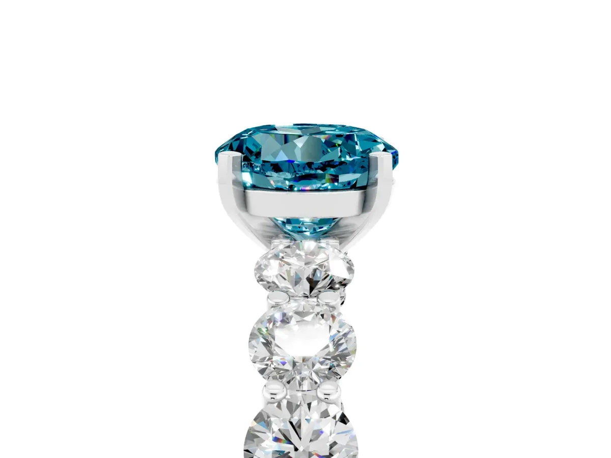 Round Cut Blue Topaz Prong Setting with Side Stones on a Pave Band Silver