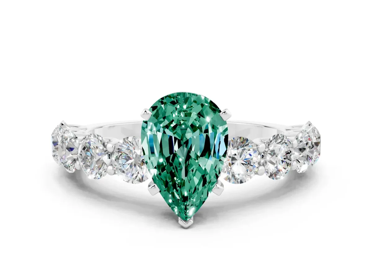 Pear Cut Green Sapphire Prong Setting with Side Stones on a Pave Band Silver