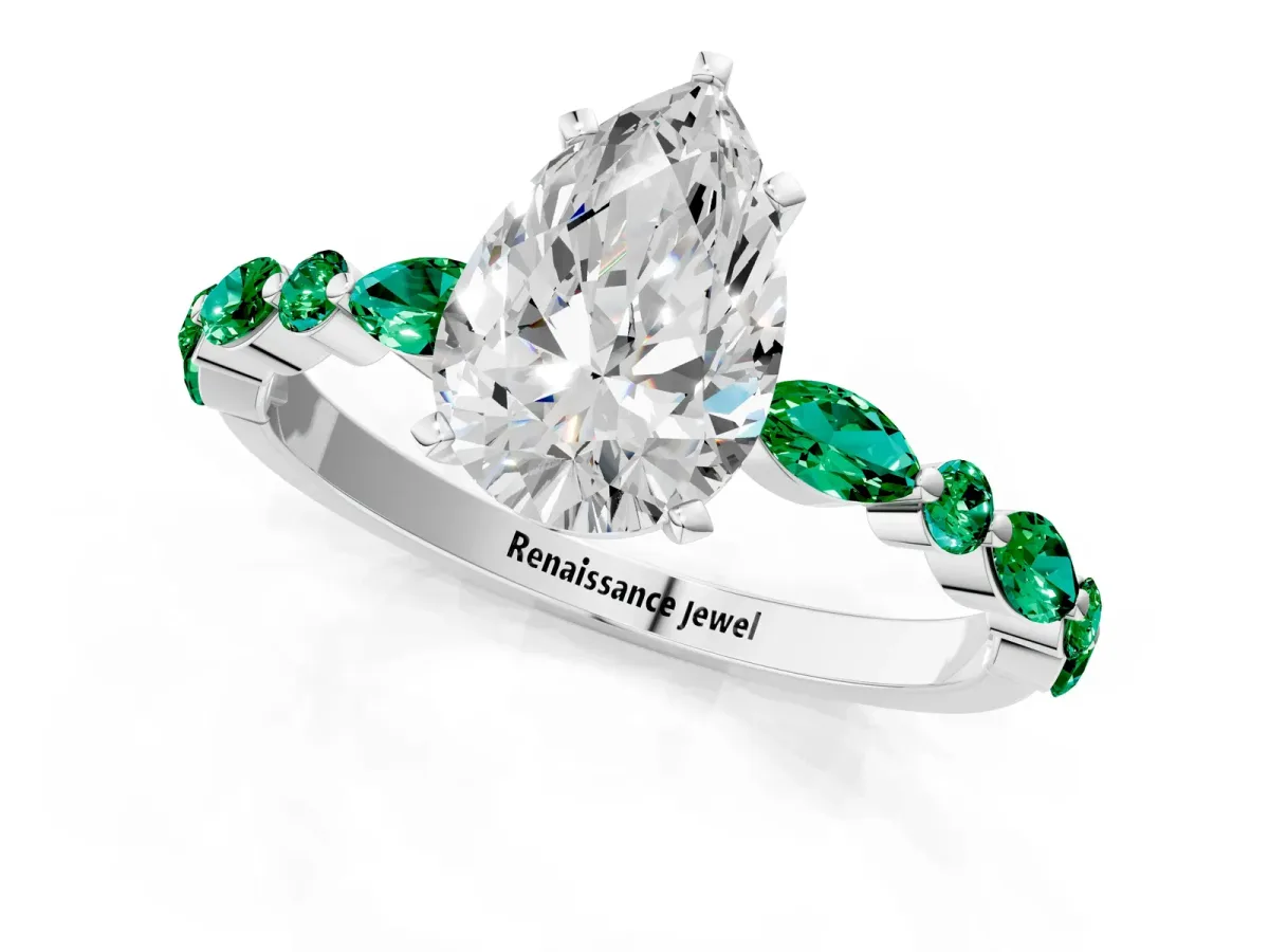Pear Cut Diamond Ring with Marquise and Round Emerald Side Stones and Four-Prong Setting Silver