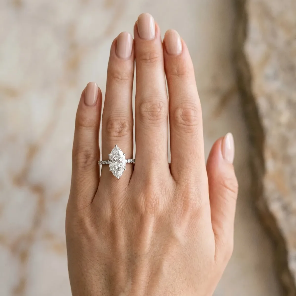 Marquise Cut Diamond Solitaire Ring with Round Pavé Shoulders and Prong Setting White gold
