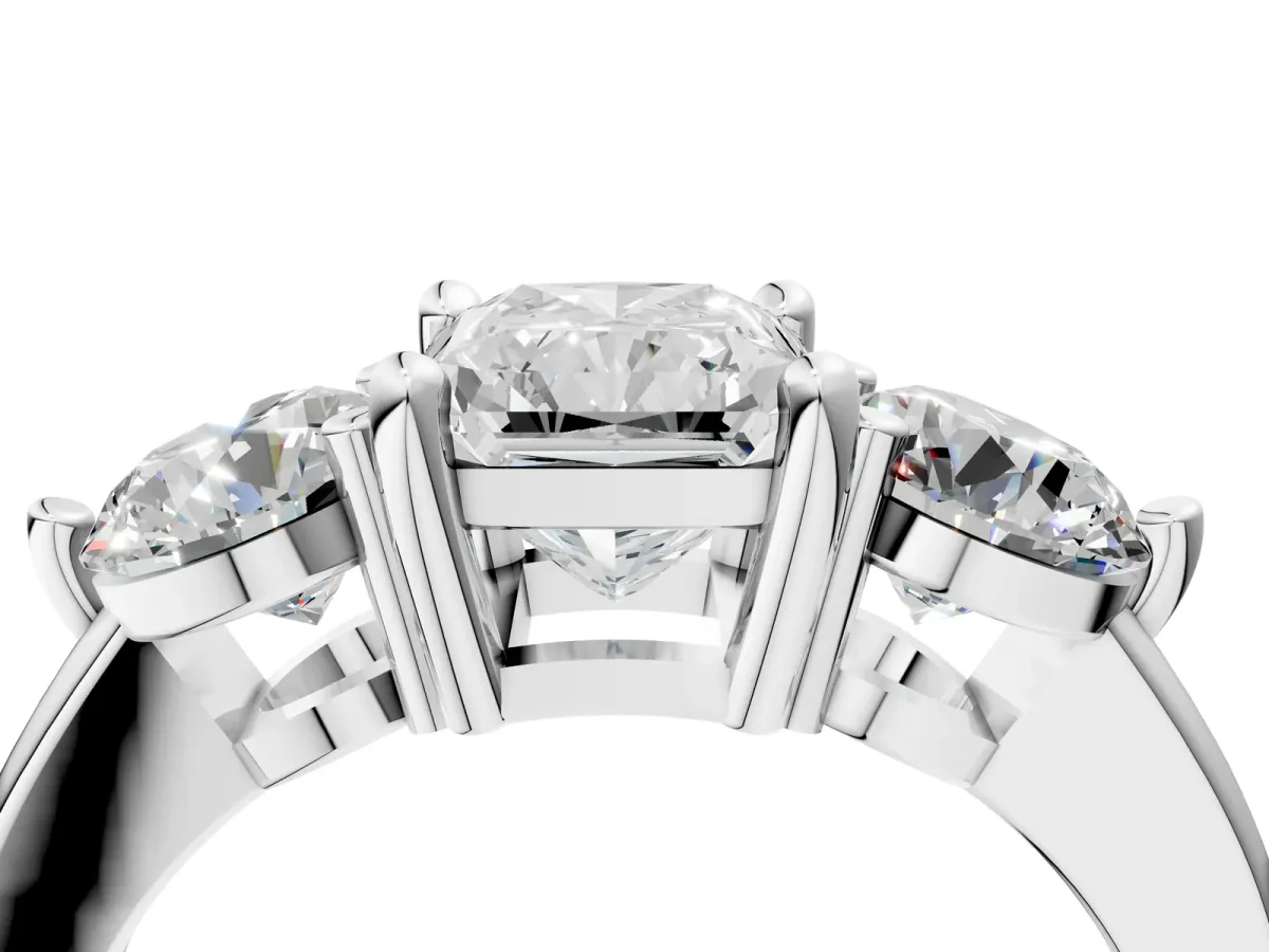 Three-Stone Radiant Cut Brilliant Cut Solitaire Ring with Prong Setting on a Classic Band Platinum