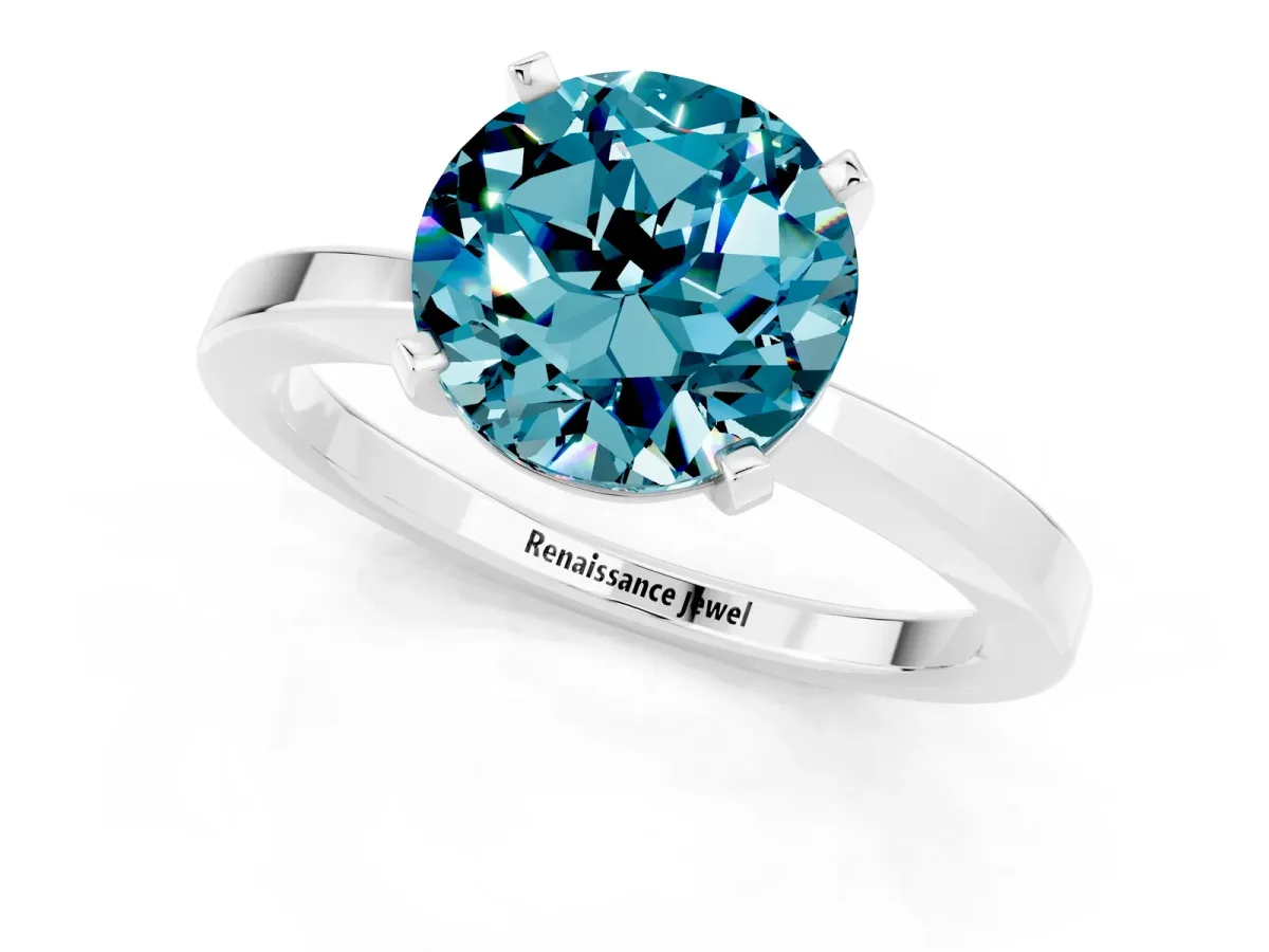 Round Cut Blue Topaz Solitaire Engagement Ring with Classic Band and Four-Prong Setting Silver