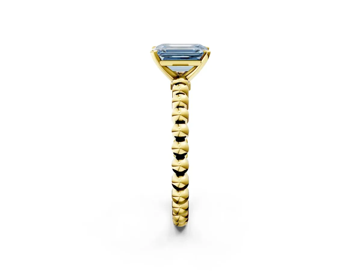 Fancy Blue Emerald Cut Diamond Solitaire Ring with Beaded Band and Prong Setting Yellow gold
