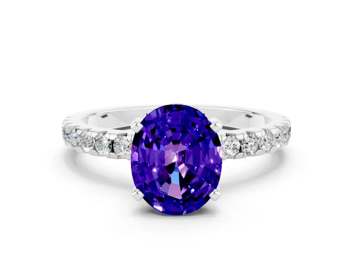 Oval Cut Tanzanite Solitaire Ring with Round Pavé Band and Four-Prong Setting Silver