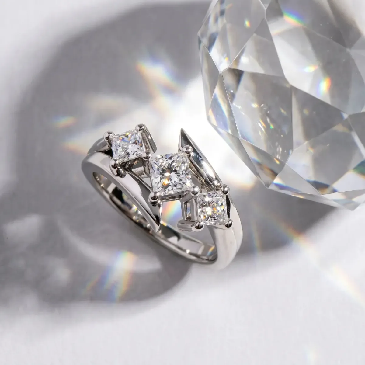 Three-Stone Princess Cut Cut Tension Band Ring with Four-Prong Setting Platinum
