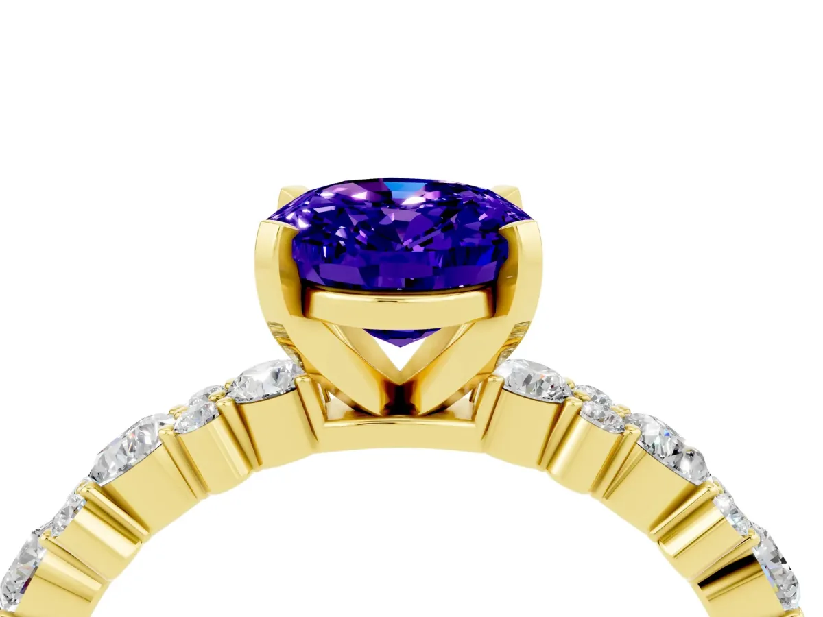 Oval Cut Tanzanite Side Stone Solitaire Ring with Round and Four-Prong Setting Yellow gold