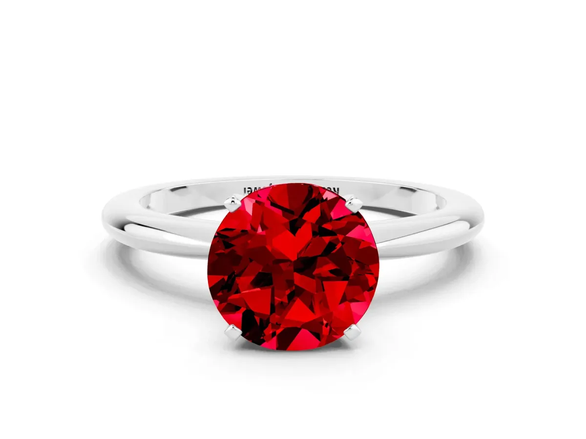 Round Cut Ruby Solitaire Ring with Six-Prong Setting and Classic Band Platinum