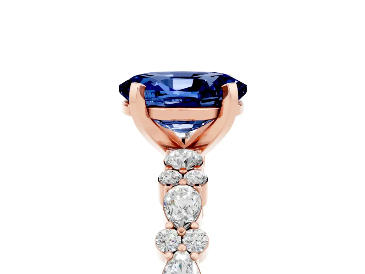 Oval Cut Blue Sapphire Side Stone Solitaire Ring with Round and Four-Prong Setting Rose gold