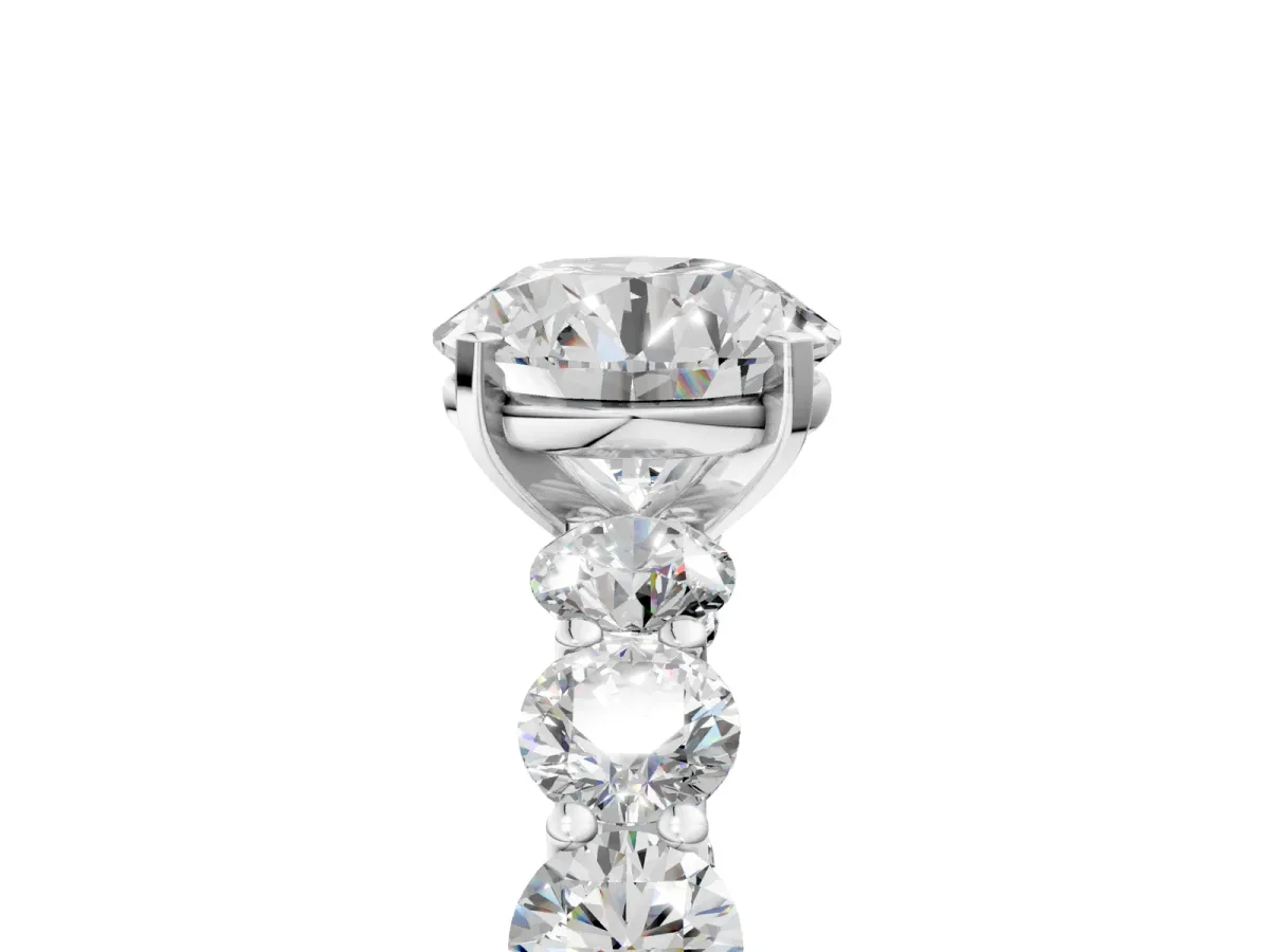 Round Cut Diamond Prong Setting with Side Stones on a Pave Band Platinum