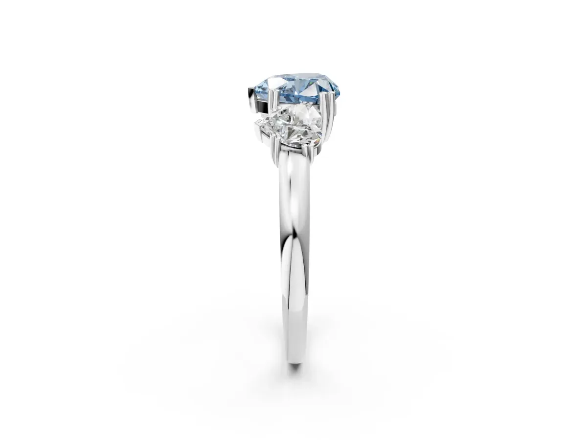 Fancy Blue Three-Stone Heart Cut Cut Diamond Ring with Channel Set Band and Four-Prong Setting Silver