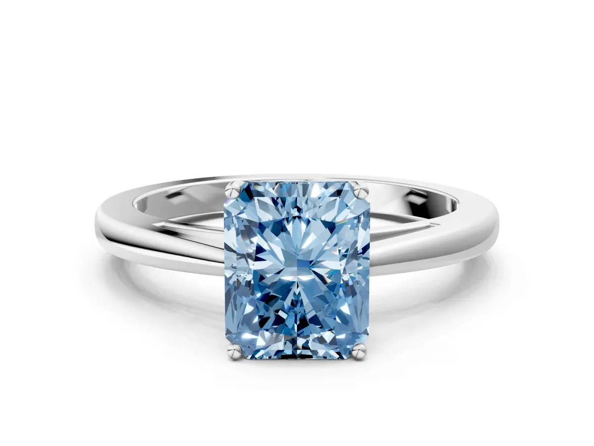 Fancy Blue Radiant Cut Solitaire Diamond Ring with Split Shank and Four-Prong Setting Platinum