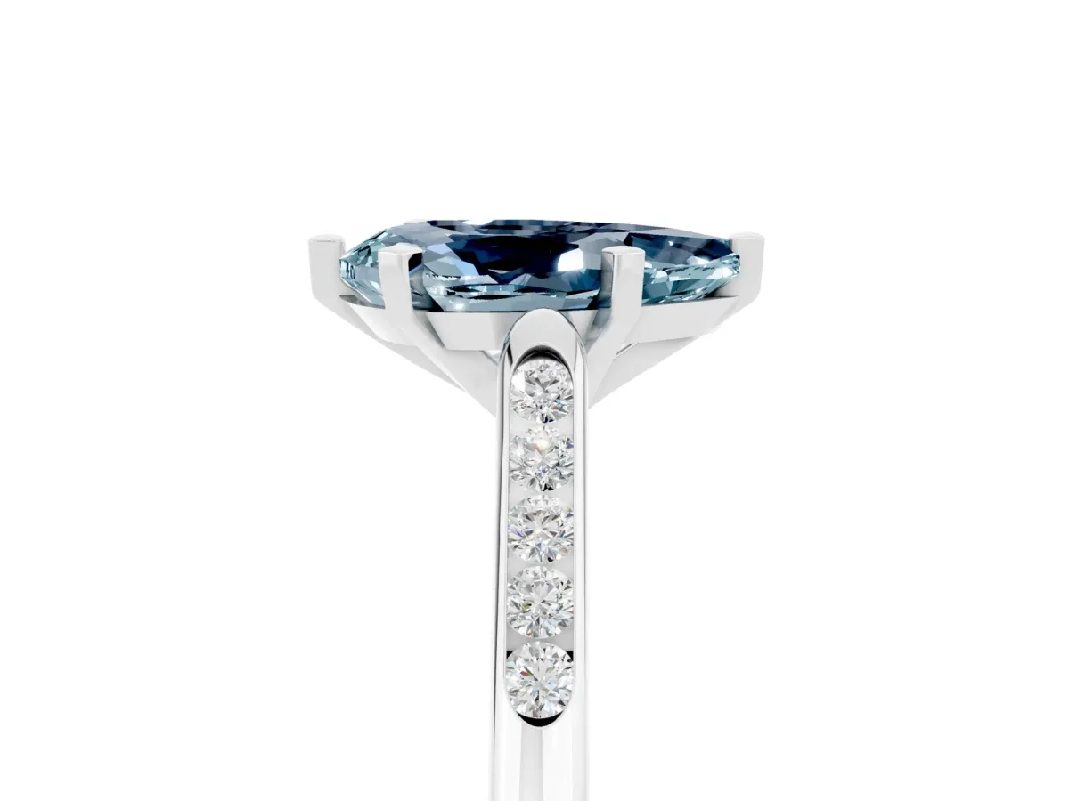 Pear Cut Aquamarine Solitaire Ring with Channel Set Round Band and Prong Setting Silver